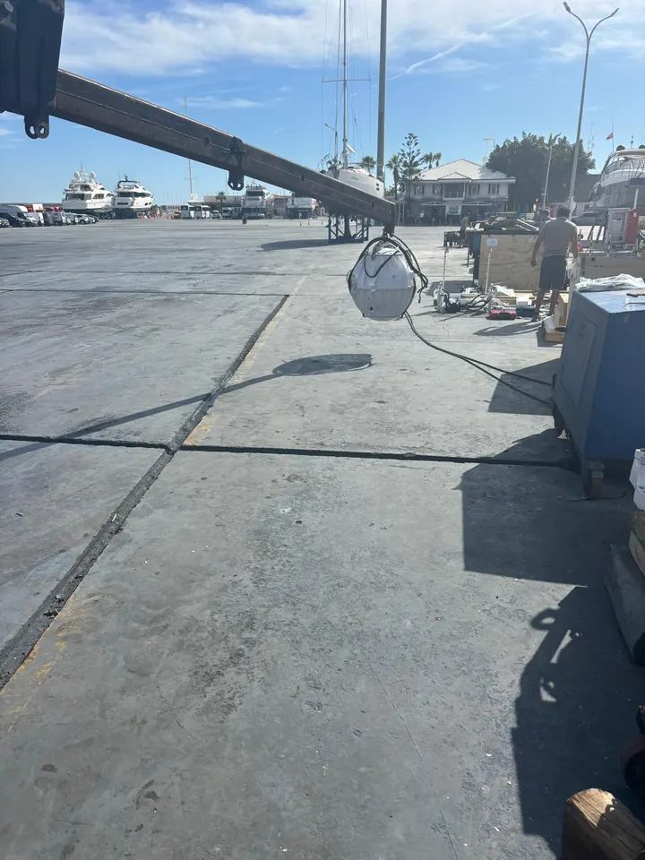 Lowering a Seakeeper gyro stabilizer into the boat by crane