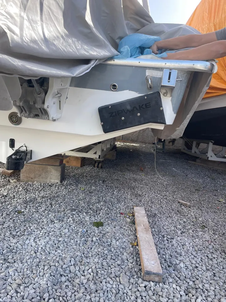 Zipwake interceptor installation on a hauled-out boat